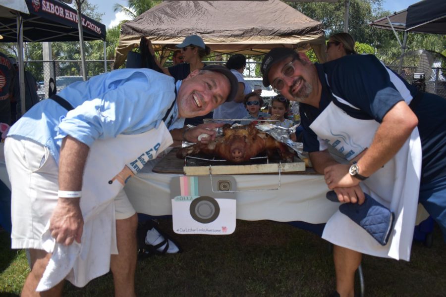 Students from all grades competed in this event. People spent all day roasting and perfecting their recipes. This years Freshmen had many boths including this one serving some mouth watering Lechon. 