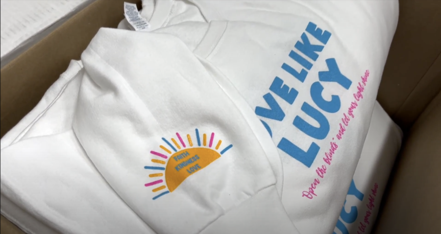 These Love Like Lucy sweatshirts were available for purchase in colors blue and white, with the design by OLLA student Hailey Hernandez 23. 