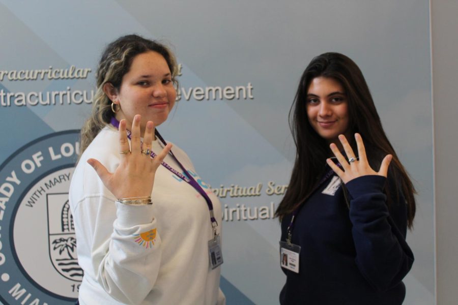 Seniors Alexia Esquivel and Sofia Vega showing off their class rings. 