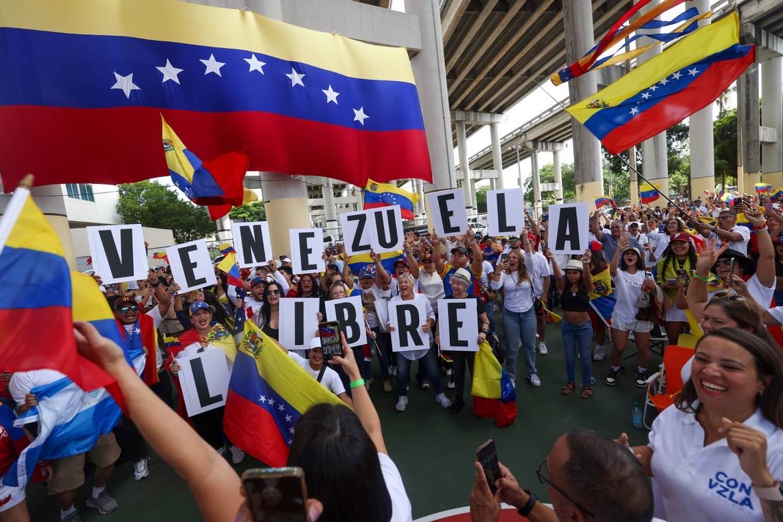 Crowds chant ‘Venezuela libre’ underneath the I-95 ramp in Downtown Miami.