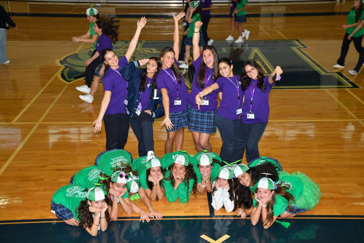 Seniors posing with their Freshmen Little sisters after the Big Sister/ Little Sister Ghetty.