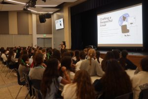 Ms. Olga Martinez delivering a presentation on the steps for proper email etiquette to the class of 2028.