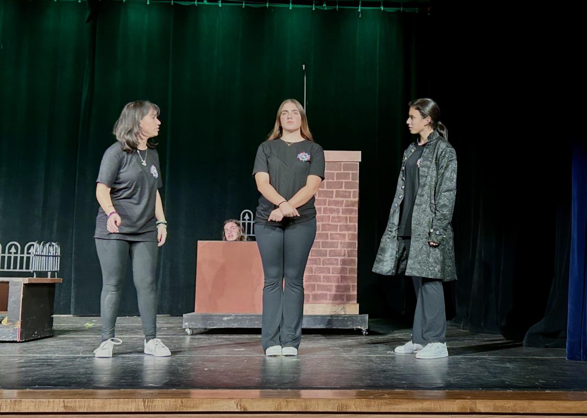 Seniors Hailey Scott, Andrea Lavin, and Isabella Cabrera perform during their one act play Antigone. (Photo courtesy of Erin Ryan)